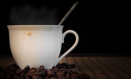 hot coffee with smoke over cup の写真素材
