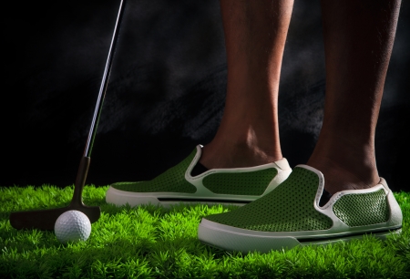 golf ball on green grass fieldの写真素材
