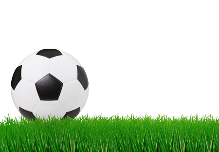 soccer football on green grass and white space backgroundの写真素材