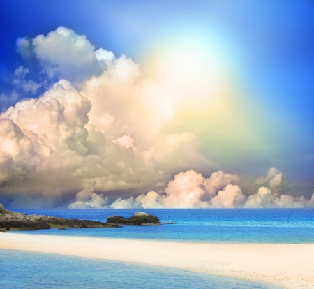 sun shining on blue sky and sand beach with nobodyの写真素材