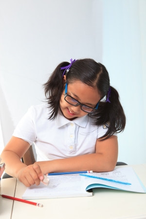 girl happy to do home work の写真素材