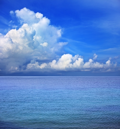 clear blue sky white cloud and sea water の写真素材