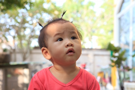 head shot of asian baby dressing hair の写真素材
