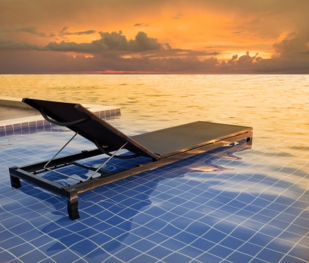 this file made from retouching as pool bed and dusky sky sun setの写真素材
