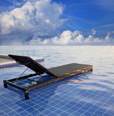 this file made from retouching as a pool bed and blue sky white cloudの写真素材
