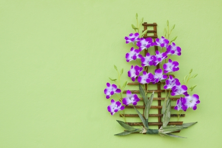 orchid flower bouquet decorated on green wall with free space areaの写真素材