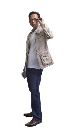 file of young man holding a book and standing on white backgroundの写真素材
