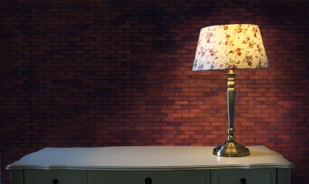 big brick wall and light lamp on white table use for multipurposeの写真素材