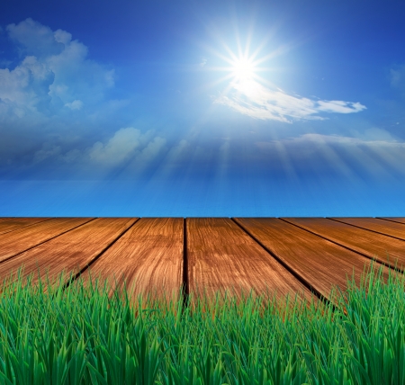wood terrace and sun shining on blue skyの写真素材