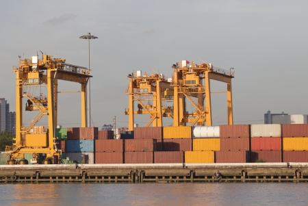 ship yard with heavy crane with container box use for import export industry and international trading の写真素材