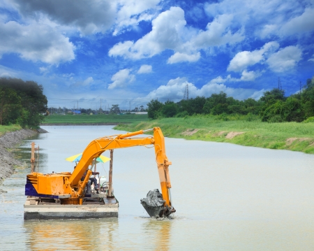 	heavy machine working in canalの写真素材