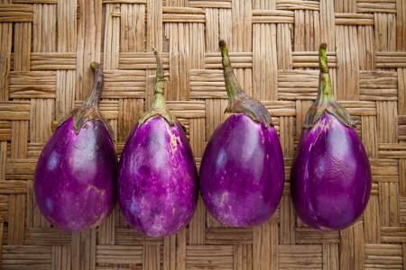 purple eggplant on bamboo craft  use for multipurposeの写真素材