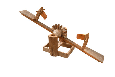 horse head wooden toy for children seat on rise up and get down by balancing isolated on white の写真素材