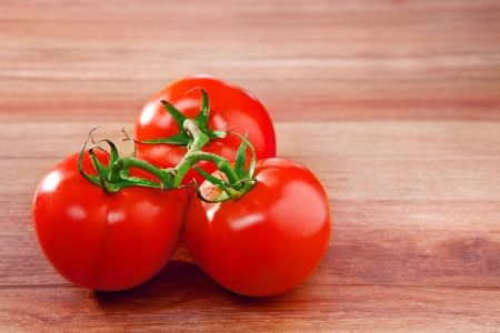 fresh three of tomato on top wood table with copy space for fill text and advertisingの写真素材