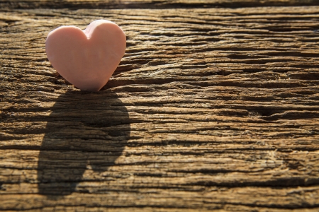 soup heart on wood textured, which shadow and lightの写真素材