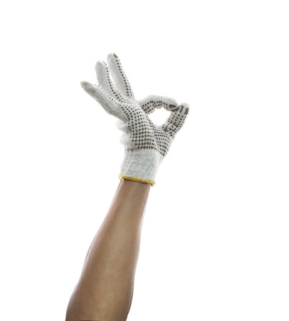 male hand wearing clothes hand glove sign o k  use for construction craft home work and related occupation の写真素材