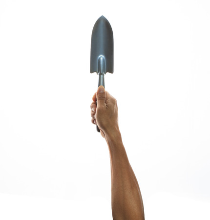 hand holding gardening tool isolated white backgroundの写真素材