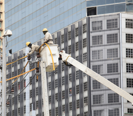electrician maintenance high voltage electric wire poleの写真素材