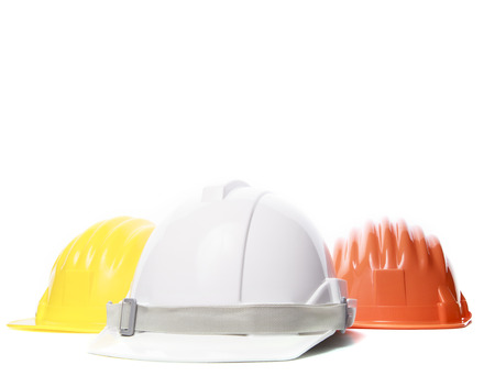 three color of safety construction protective helmet on white backgroundの写真素材