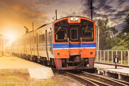 diesel engine trains on track ways station against beautiful dusky sky use for land transport and travel business themeの写真素材