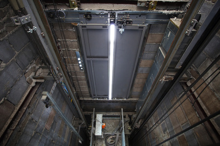 inside of roping Elevator, Lift box builting in high building show strong structure use for engineering construction and industrial object の写真素材