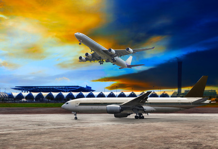 jet plane flying over runways and beautiful dusky sky with copy space use for air transport ,journey and traveling industry businessのeditorial素材
