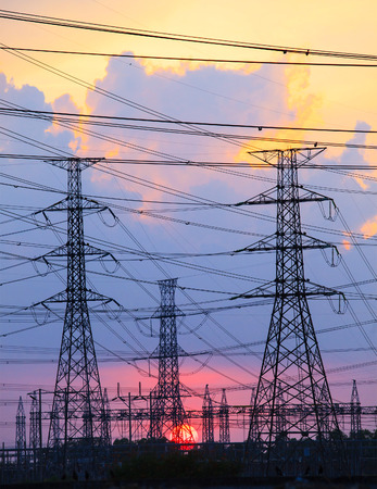 beautiful sunset behind electricity plant industry estate use as electrical power background,の写真素材
