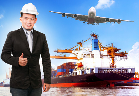business man and comercial ship with container on port freight cargo plane flying above use for import ,export and shipping logistic industry serviceの写真素材