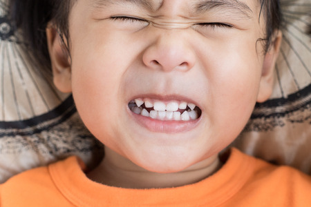 close up funny face of children toothy acting