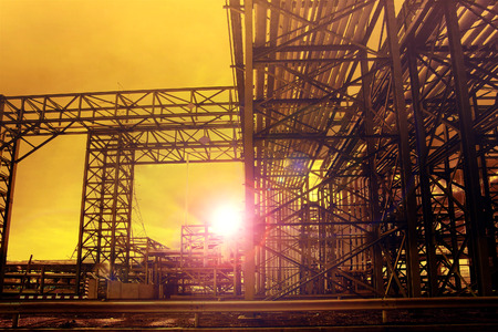 metal structure of industry chemical tube in heavy industrial estate against beautiful sun rising...