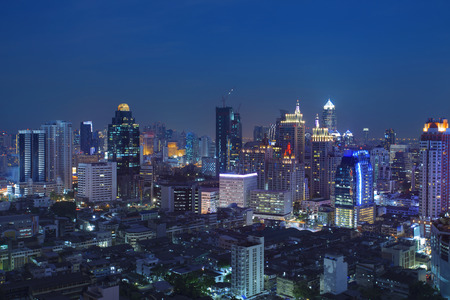 city scape in heart of bangkok thailand with beautiful lighting of office building and sky scrapper...