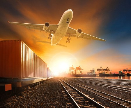 industry container trainst running on railways track plane cargo flying above and ship transport in import export container yard