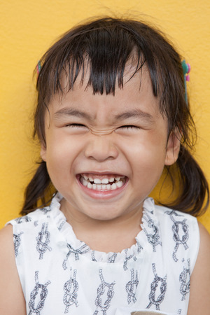 face of asian 4s year old laughing show good healthy tooth ,happy emotionの写真素材