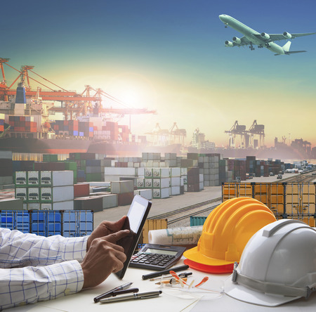 hand of business man working on working table in container dock use for logistic industry and import export , freight cargo shipping industrial hand of business man working on working table in container dock use for logistic industry and import export , freight cargo shipping industrial