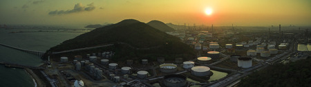 aerial view of oil refinery tank storage in heavy petrochemical industries estate against sun rising skyのeditorial素材