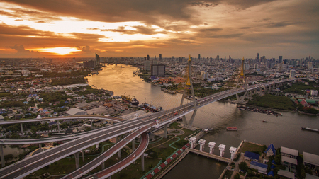 aerial view of bhumiphol bridge crossing chaopraya river important landmark and  land transportation in bangkok thailandの写真素材