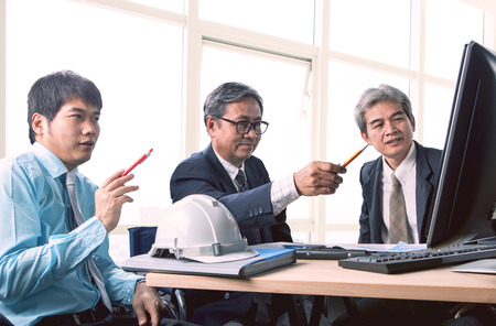 asian engineering man meeting for project solution in office operation roomの写真素材