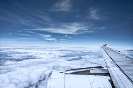 aerial view of white cloud and blue sky from plane window