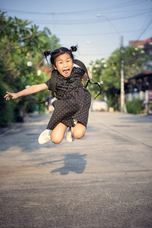 cheerful children jump and floating mid air playing with happiness emotionの写真素材