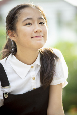 Close up head shot asian teenager smiling faceの写真素材