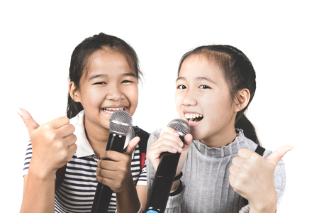 cheerful asian teenager friend  sing a song with happiness emotionの写真素材