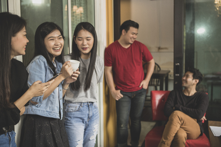 younger asian freelancer relaxing lifestyle in home officeの写真素材