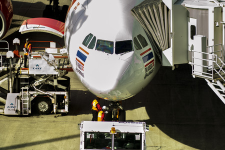 hokkaido japan - october9,2018 : airport technician checking on thai airasia plane before departure...