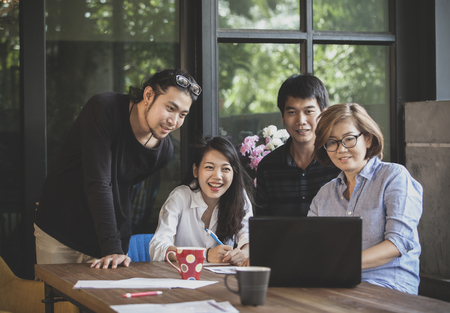 asian freelance team work looking to computer for project successfulの写真素材