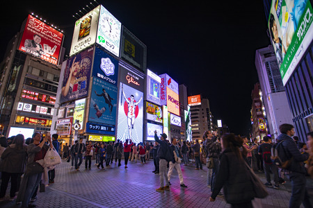 osaka japan - november6,2018 : large number of tourist attraction to dotonbori canal district place of glico brand banner sign on building wallのeditorial素材