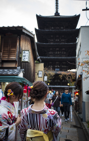 kyoto japan - november10,2018 : woman wearing kimono japanese tradition clothes attraction to yasaka shrine street one of most popular traveling destination in kyoto japanのeditorial素材