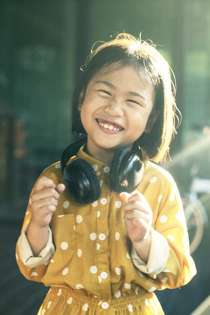 moving motion of lovely  asian children dancing with music rythm happiness emotionの写真素材
