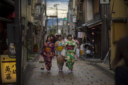 kyoto japan - november9,2018 : japanese woman wearing kimono clothes walking in yasaka shrine street most popular traveling destination in kyoto japanのeditorial素材