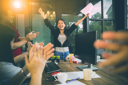 asian woman freelance happiness emotion successful project in home officeの写真素材