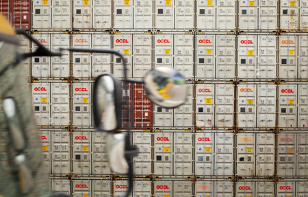 hong konng  china - march17,2019 : stack of freight container box in hong kong shipping port, hong...